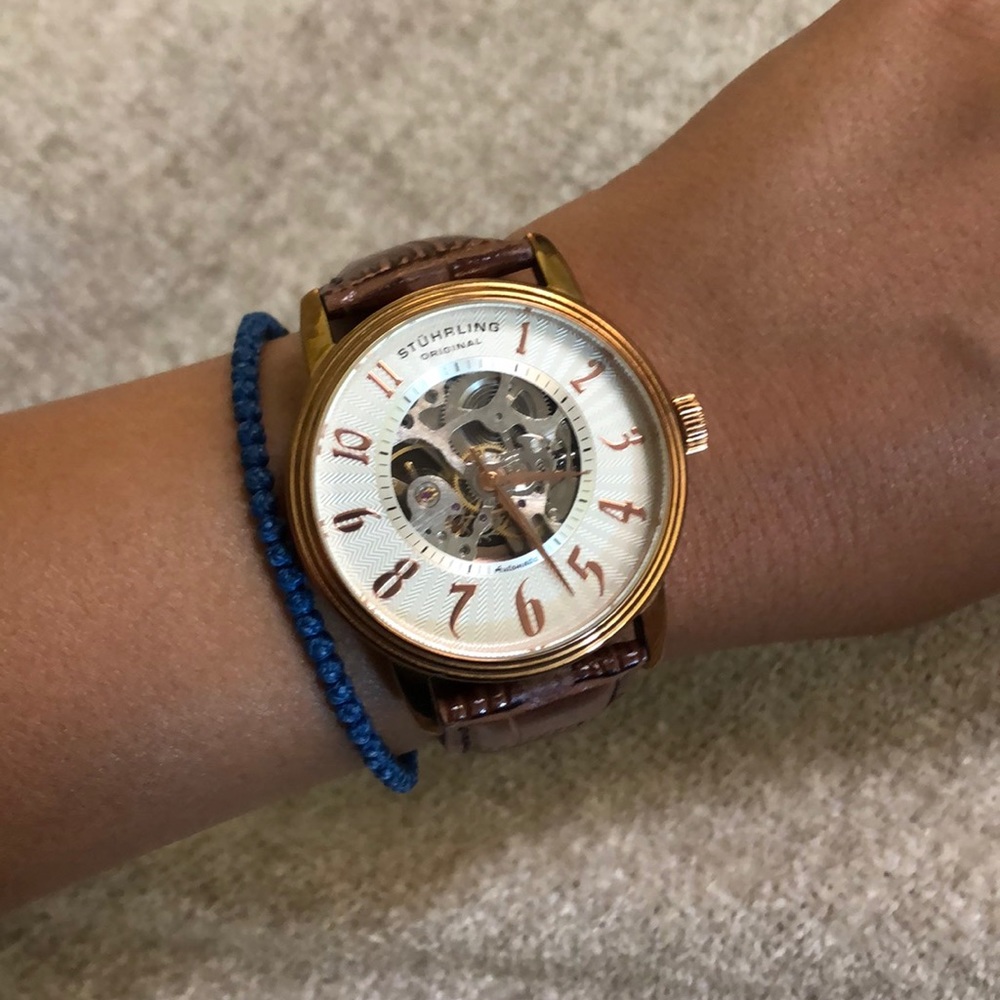 gold and leather skeleton watch
